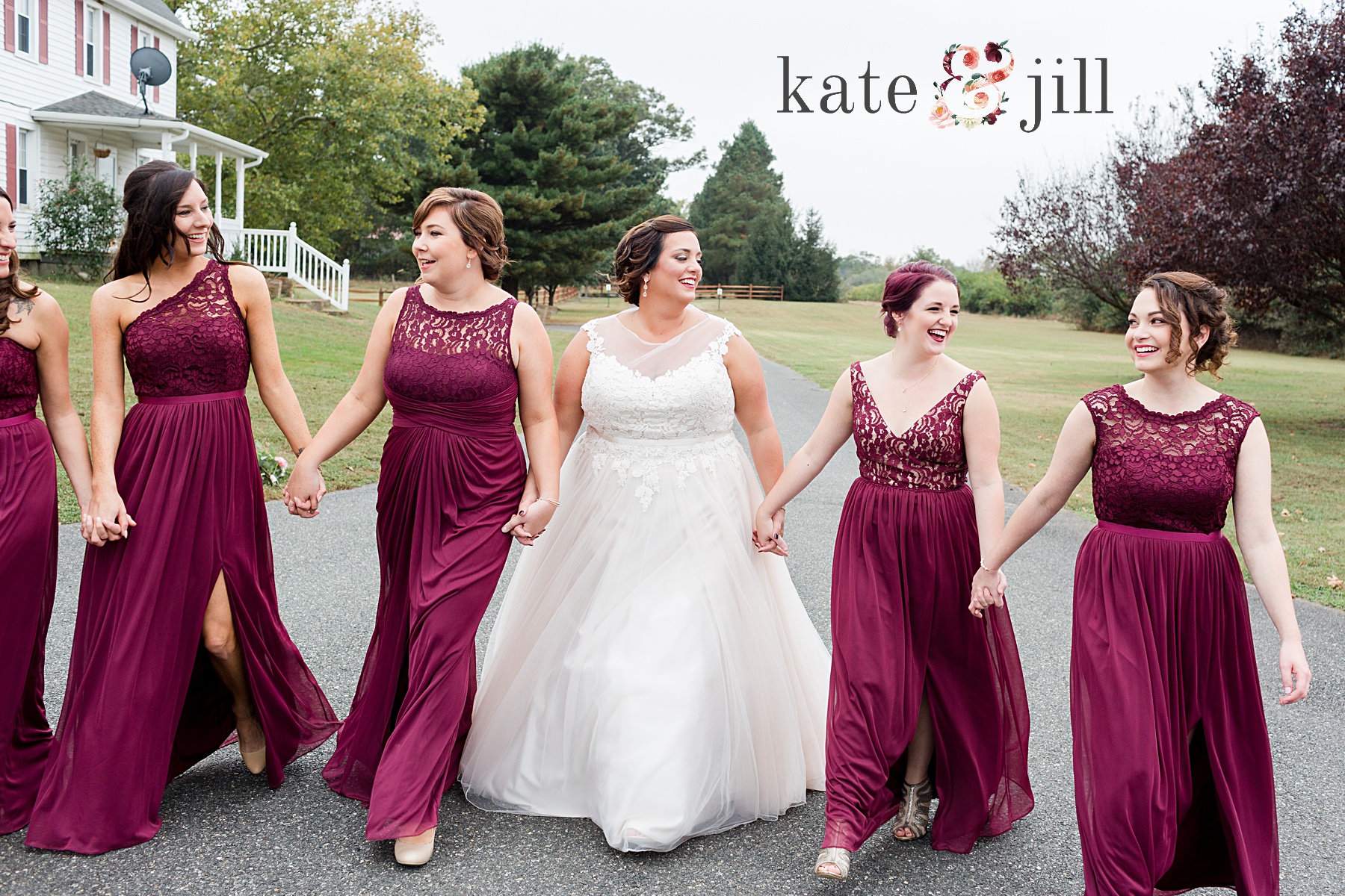bridesmaids walking together on path