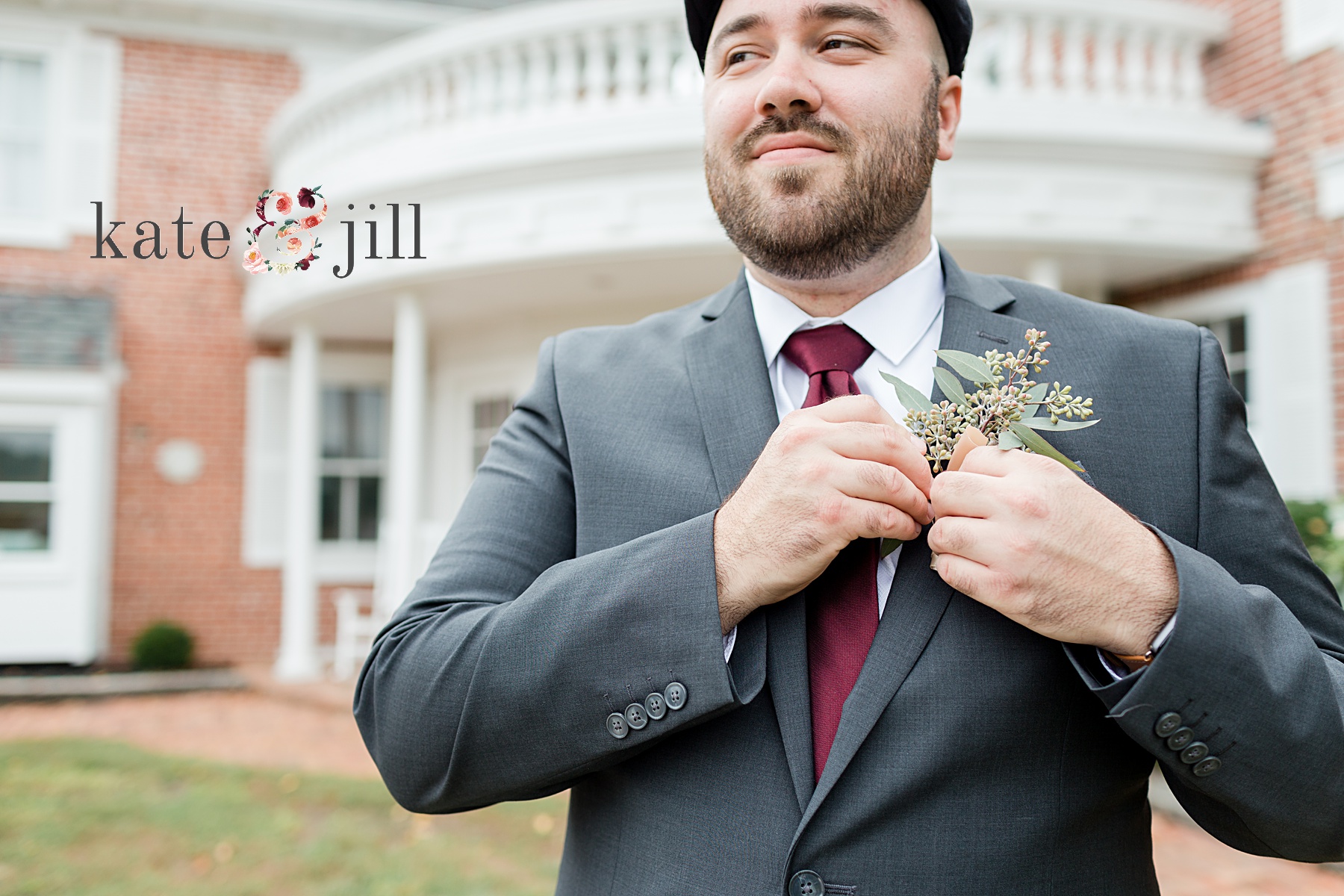 groom fixing boutonniere 