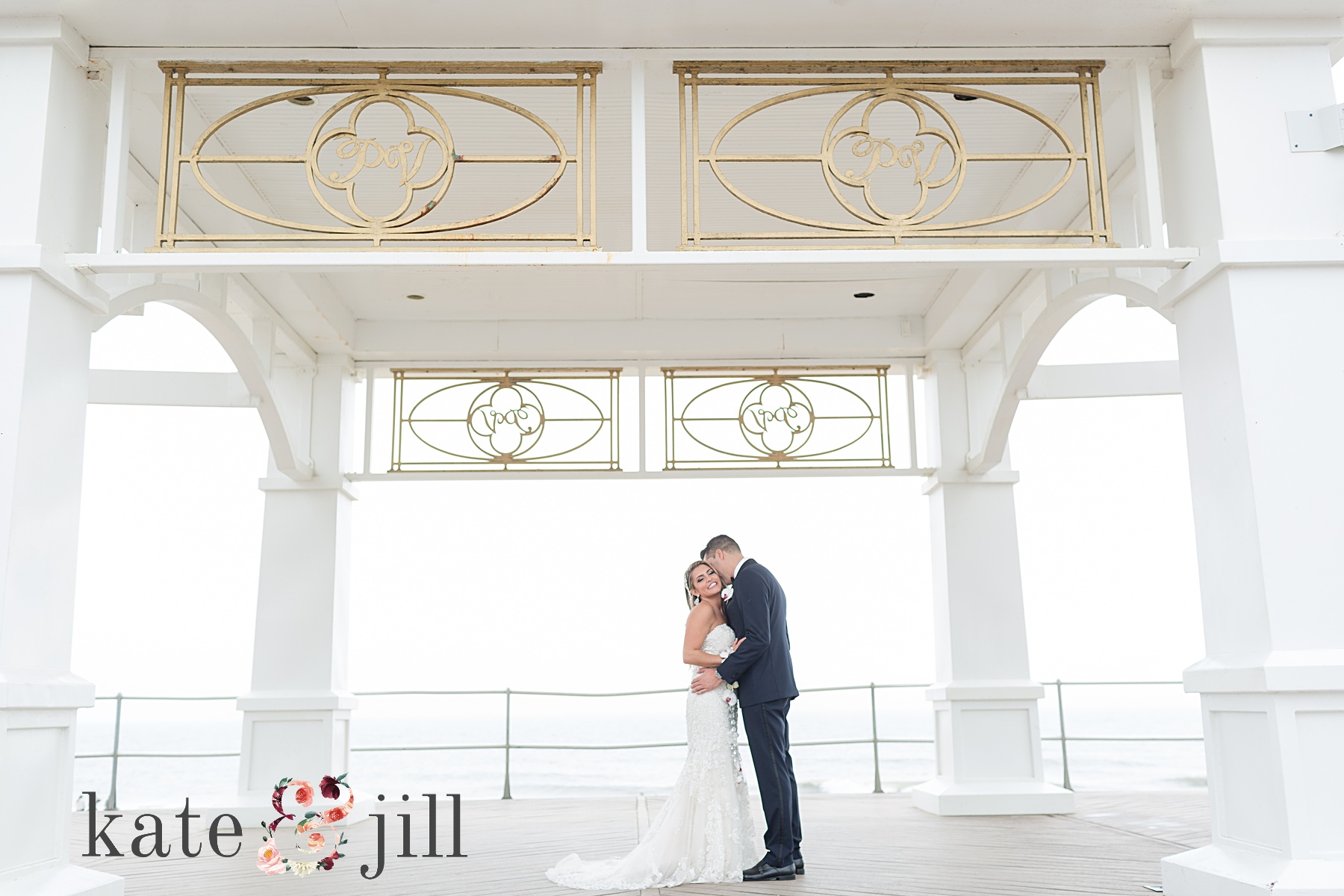 bride and groom kissing under overhang mcloone's pier house long branch