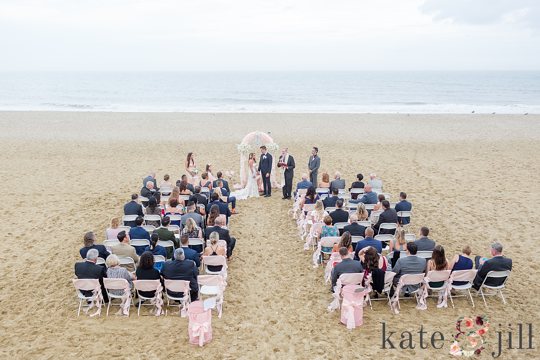 wedding ceremony photo on beach mcloone's pier house long branch
