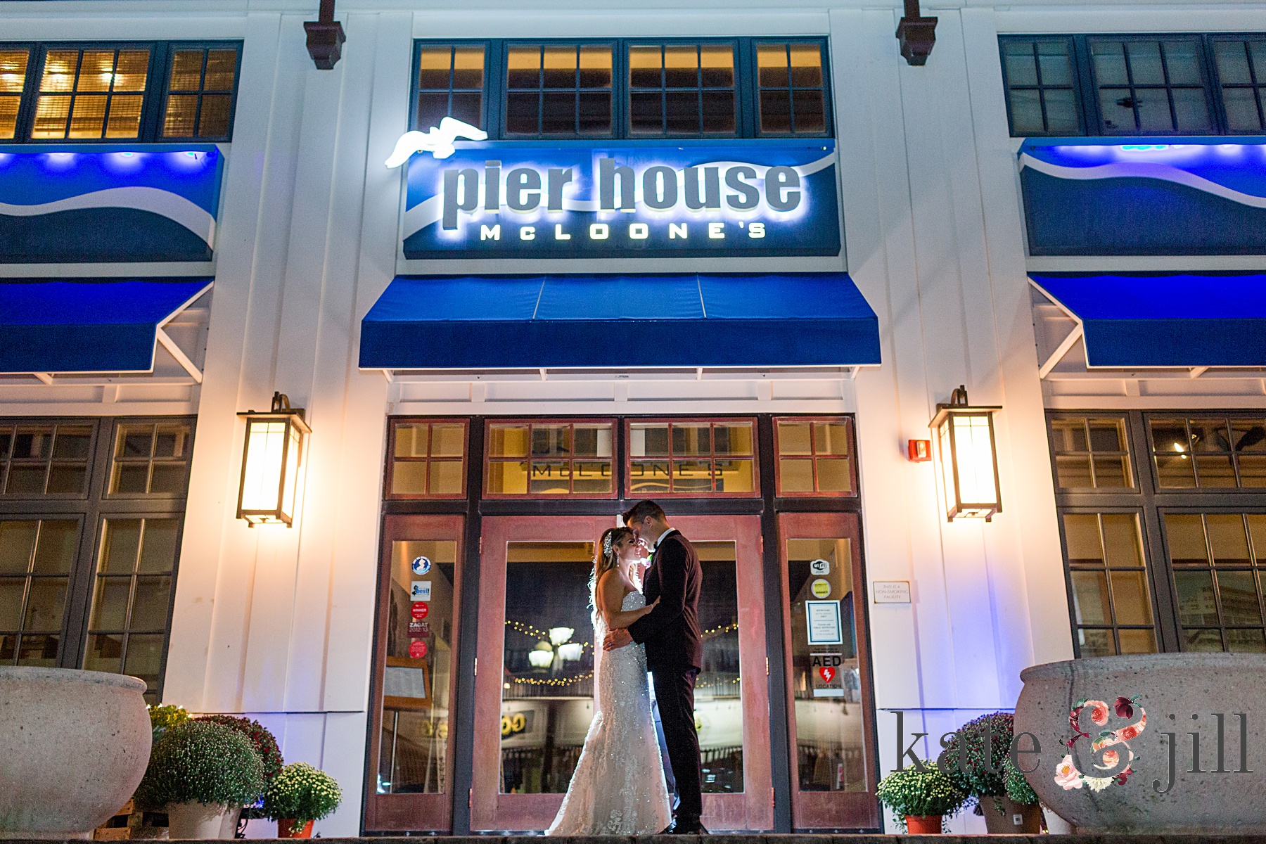 nighttime wedding photo outside of venue mcloone's pier house long branch