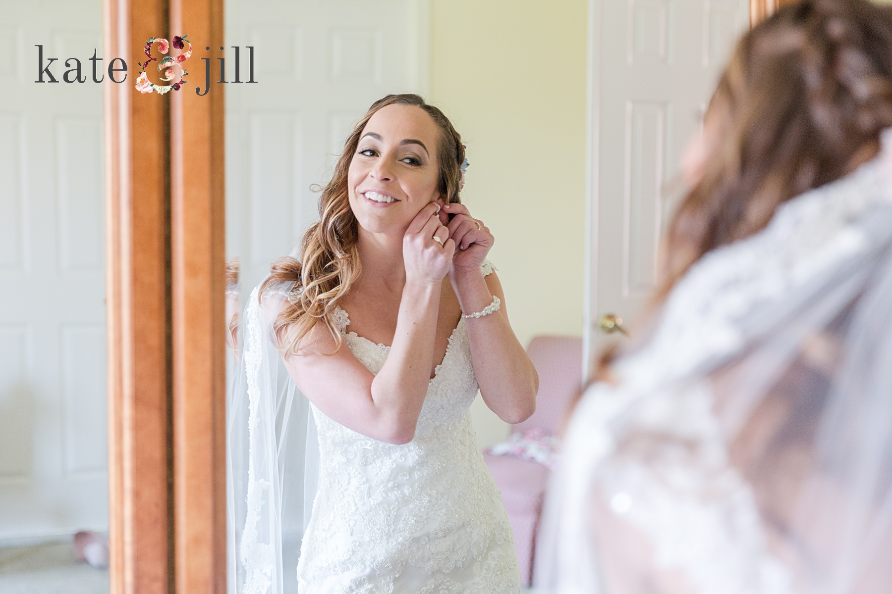 bride putting on earrings woodcrest country club wedding