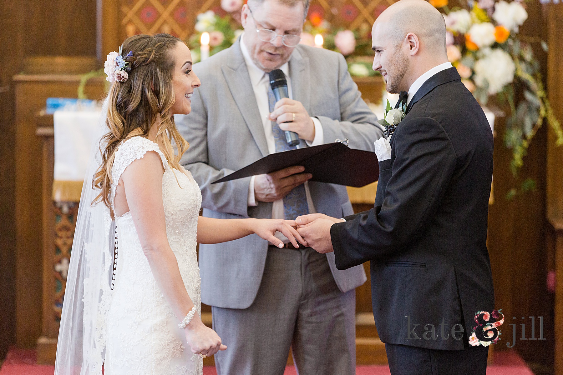 bride and groom exchanging rings woodcrest country club wedding