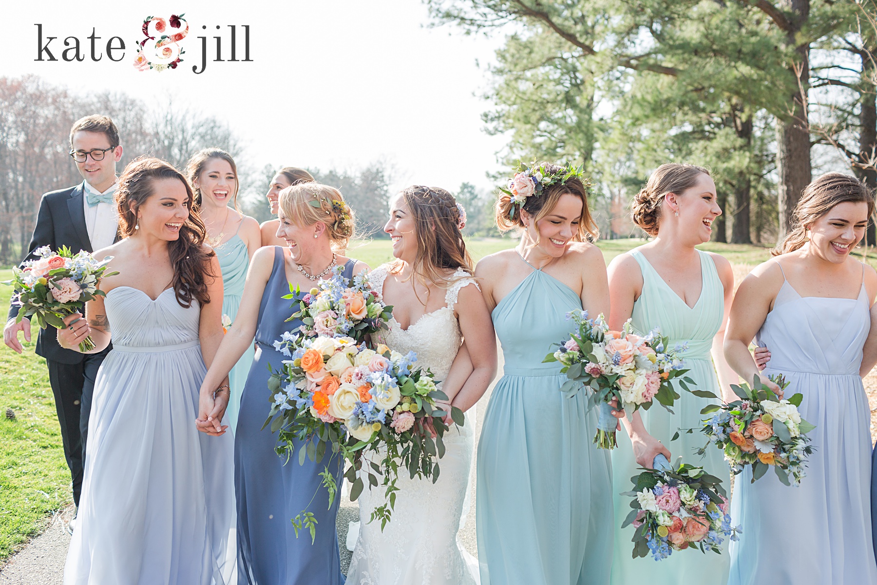 bridesmaids walking together in blue dresses woodcrest country club wedding