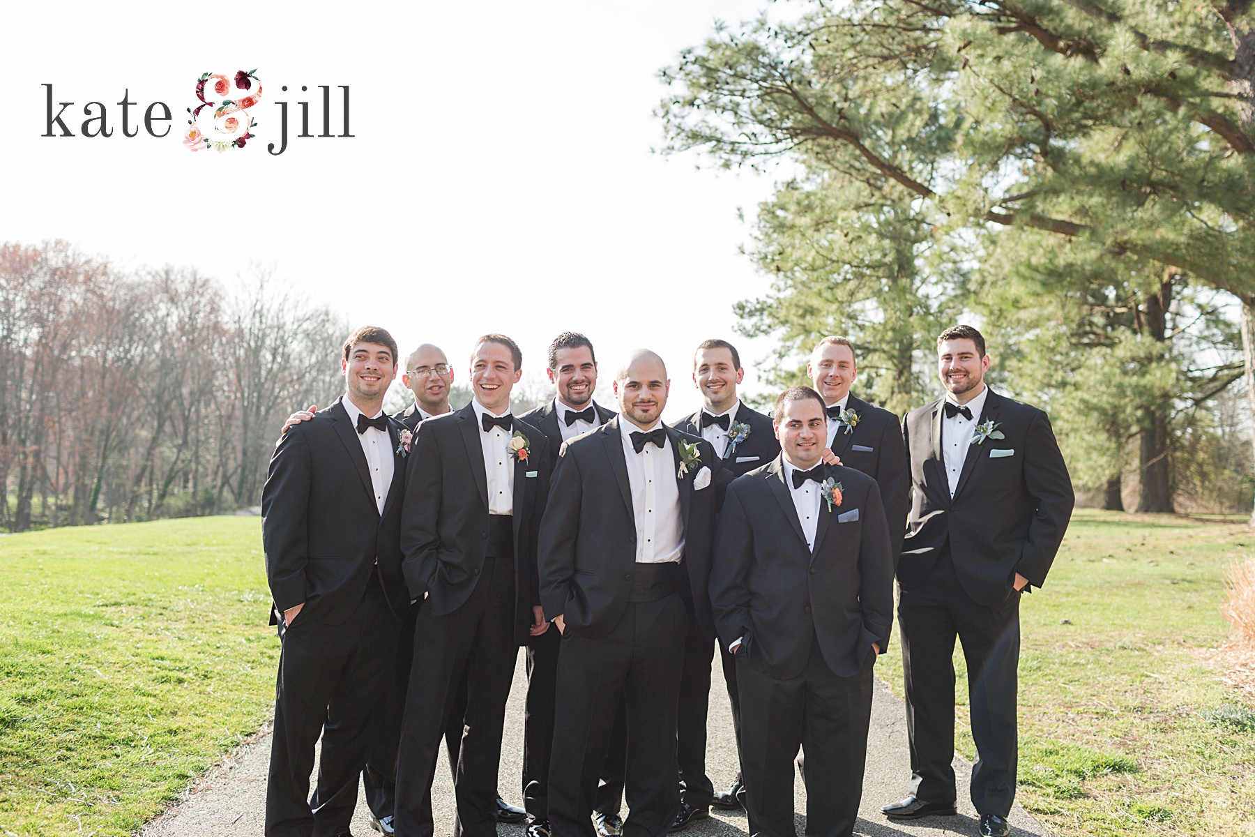 groomsmen in black tuxes on golf course woodcrest country club wedding