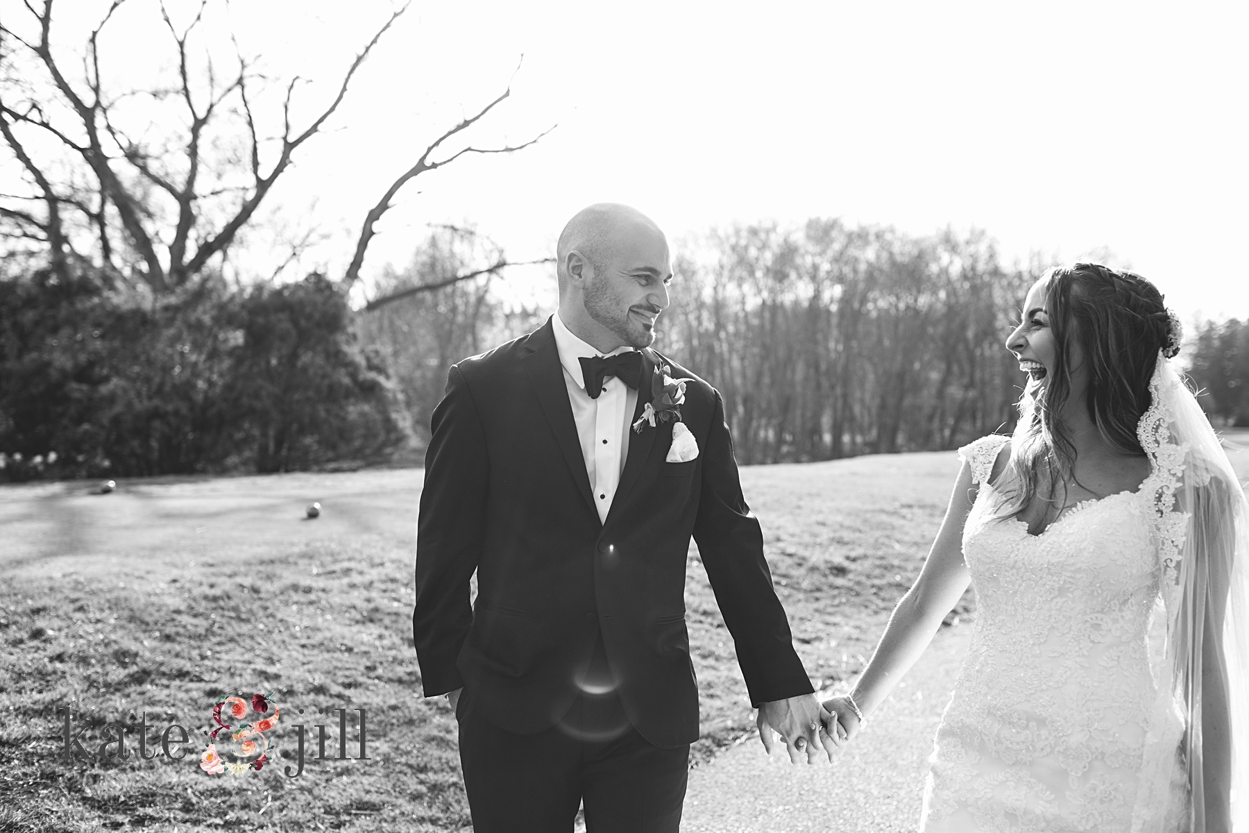 bride and groom walking and laughing woodcrest country club wedding