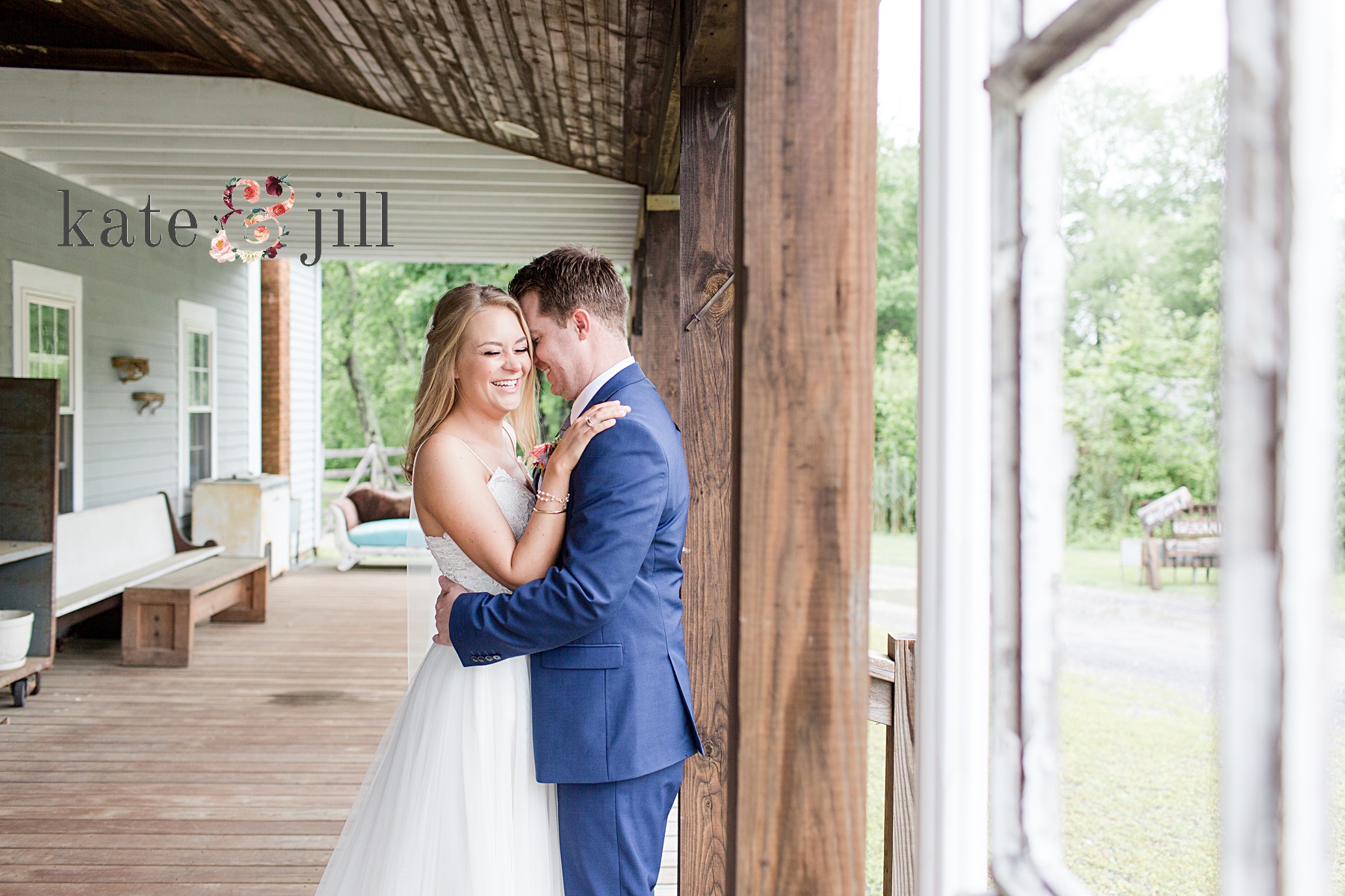 bride and groom snuggling on porch