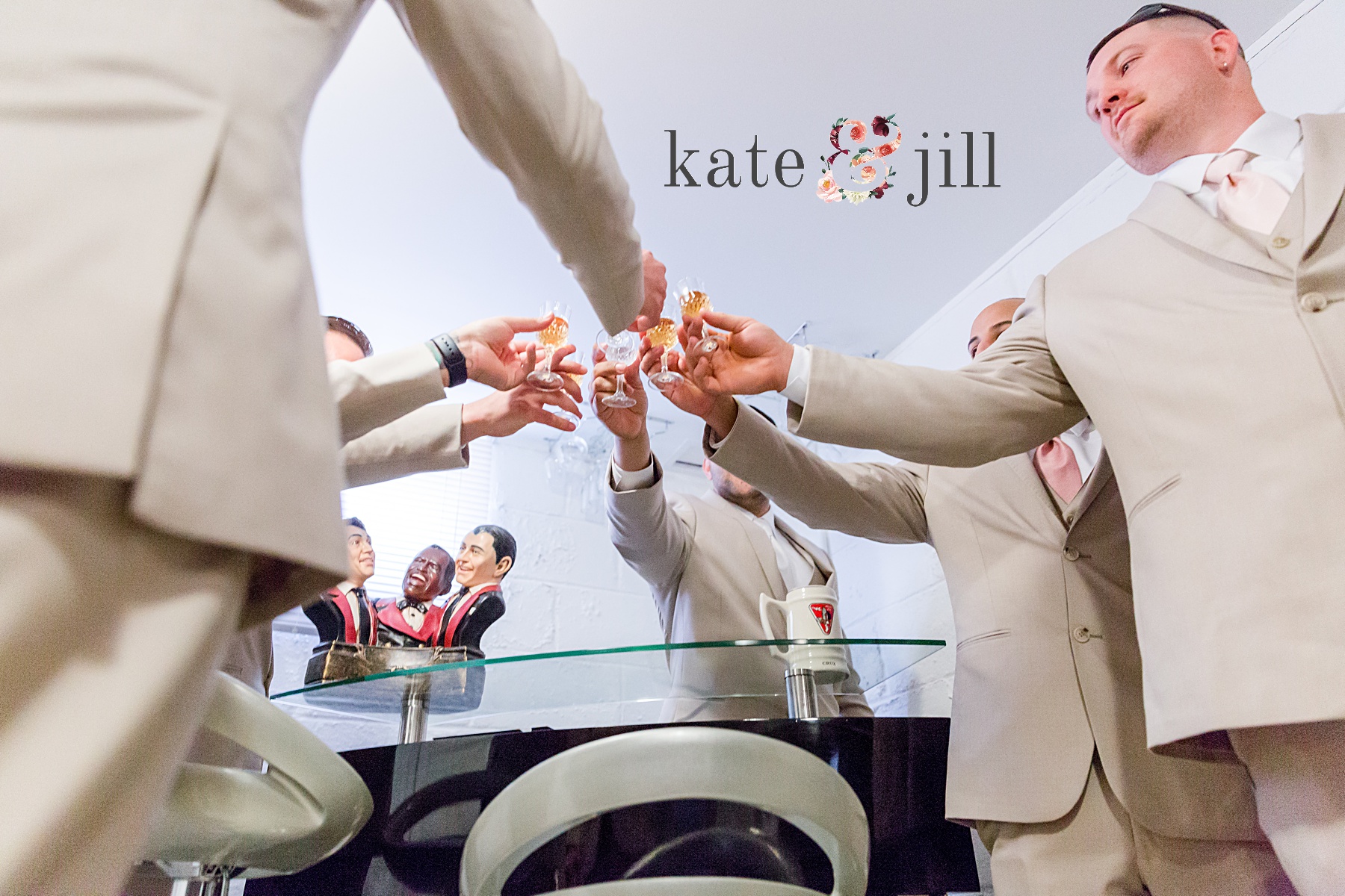 groom and groomsmen toasting during getting ready