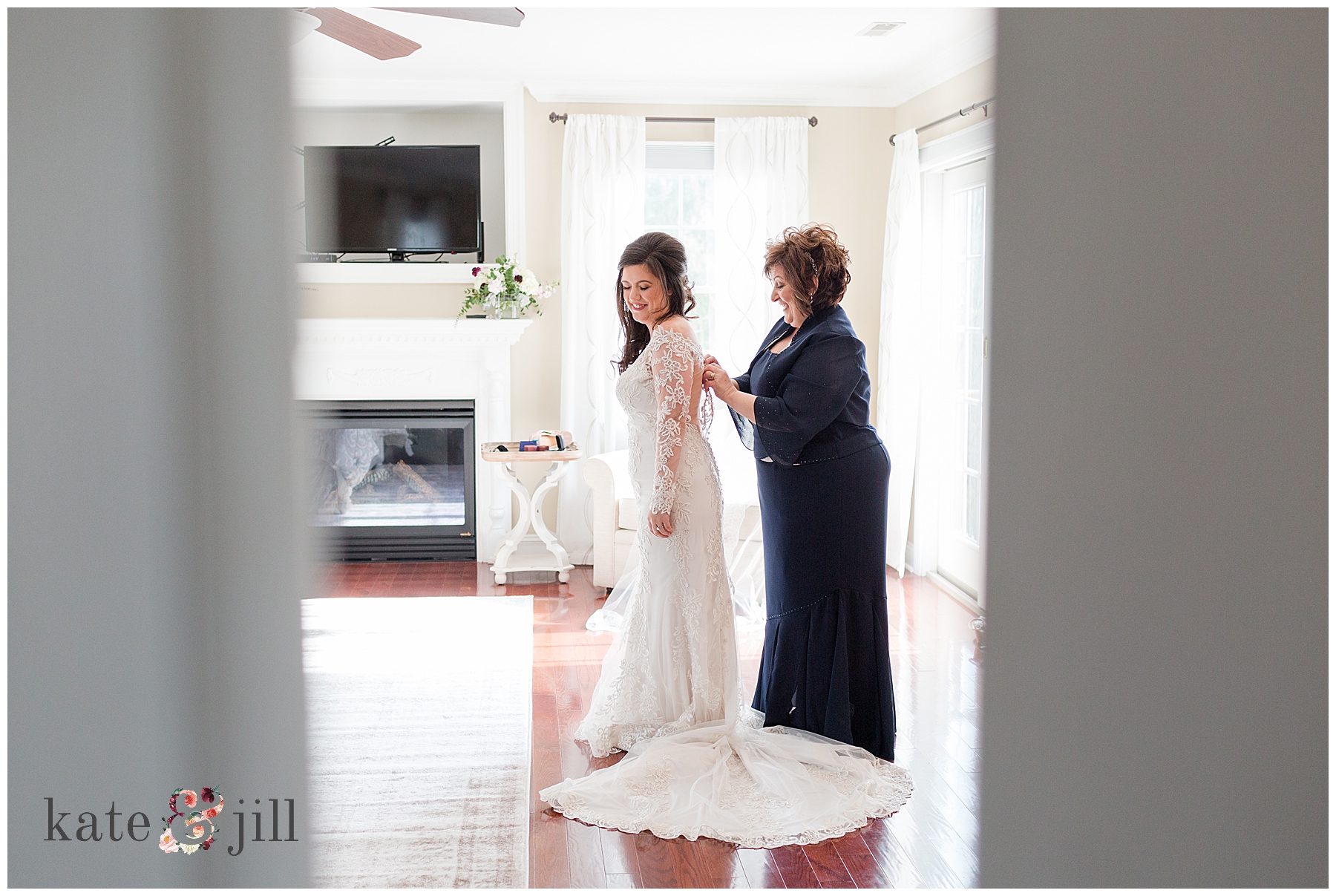 bride getting dressed with mom