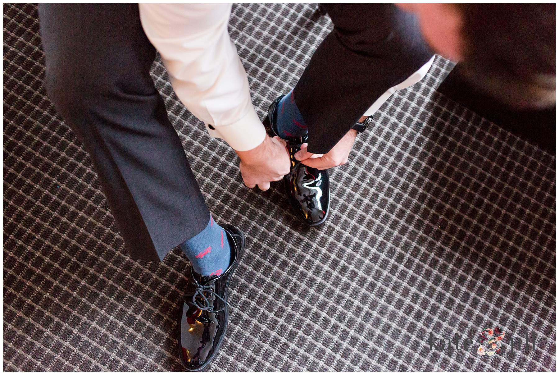 groom putting shoes on