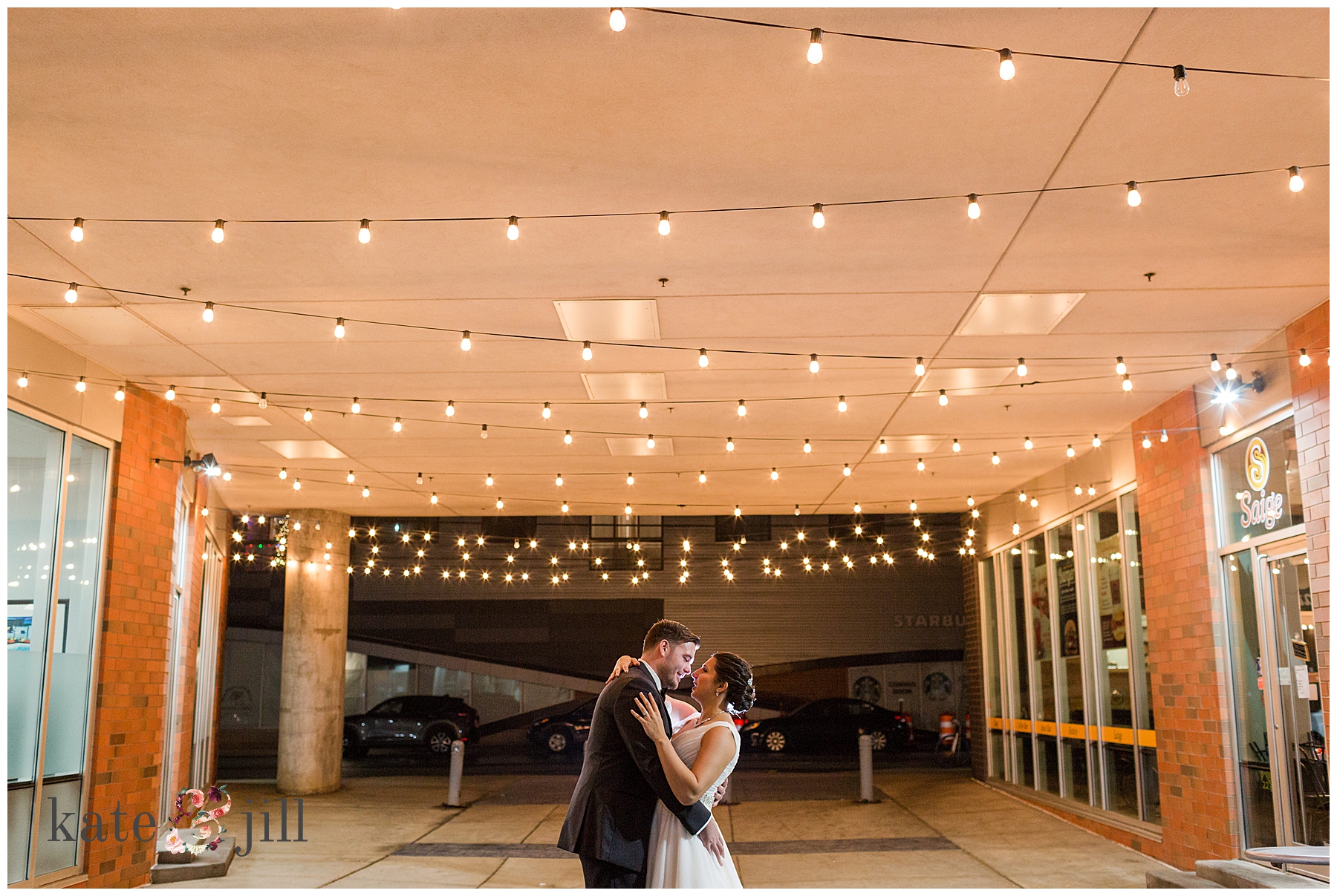 bride and groom under lights