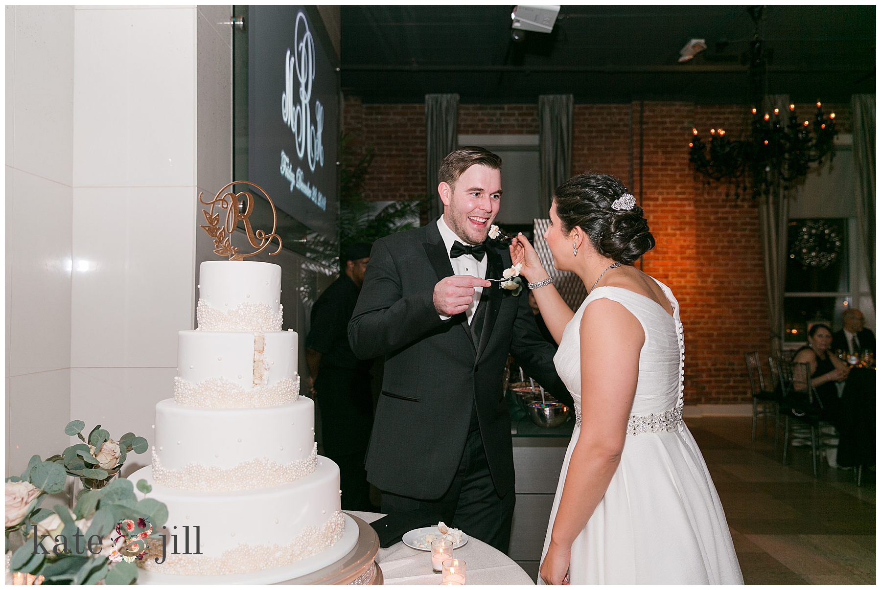 bride and groom eating cake Cescaphe wedding venue in philadelphia pa