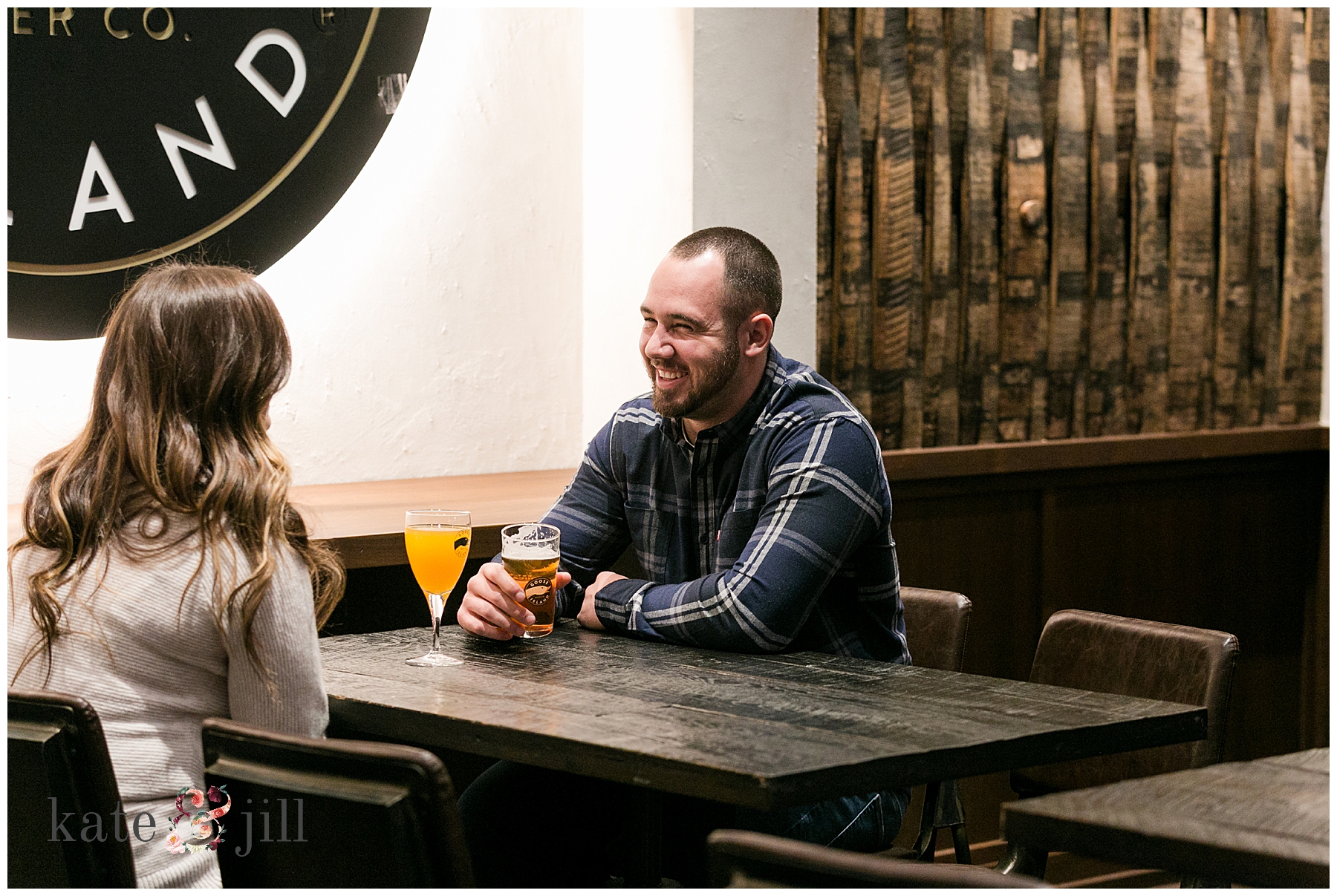 Couple drinking beer and looking at each other 