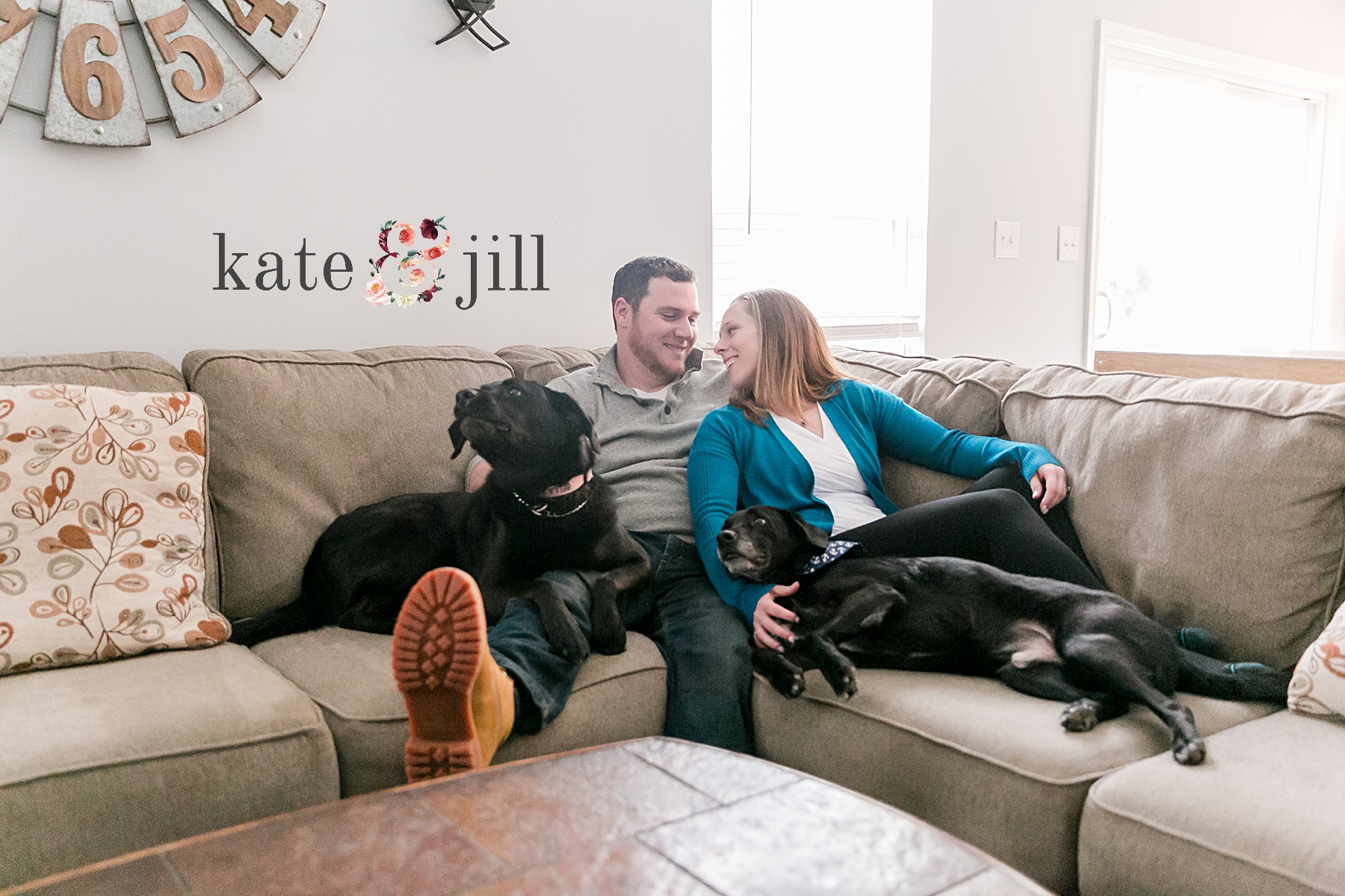 cuddling on the couch with dogs engagement session