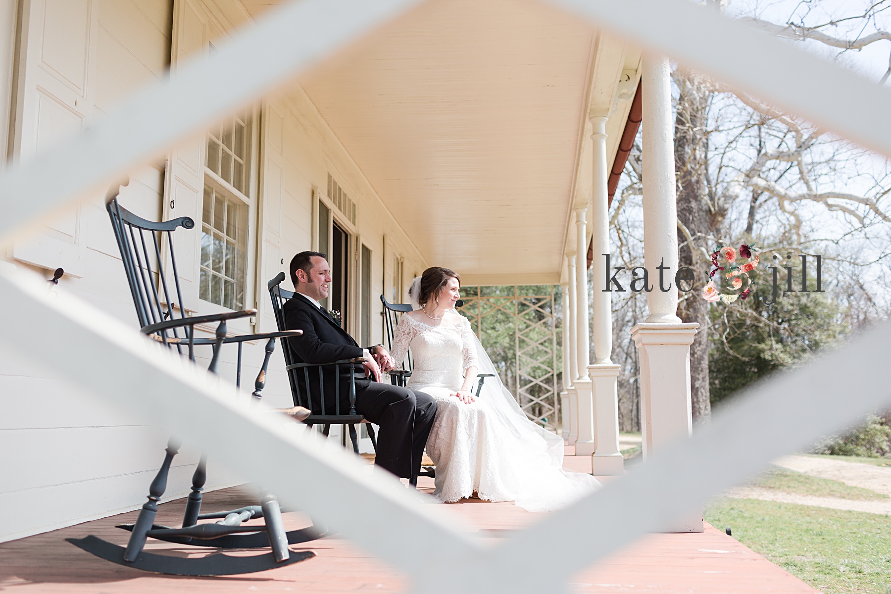 bride and groom sitting on front porch together