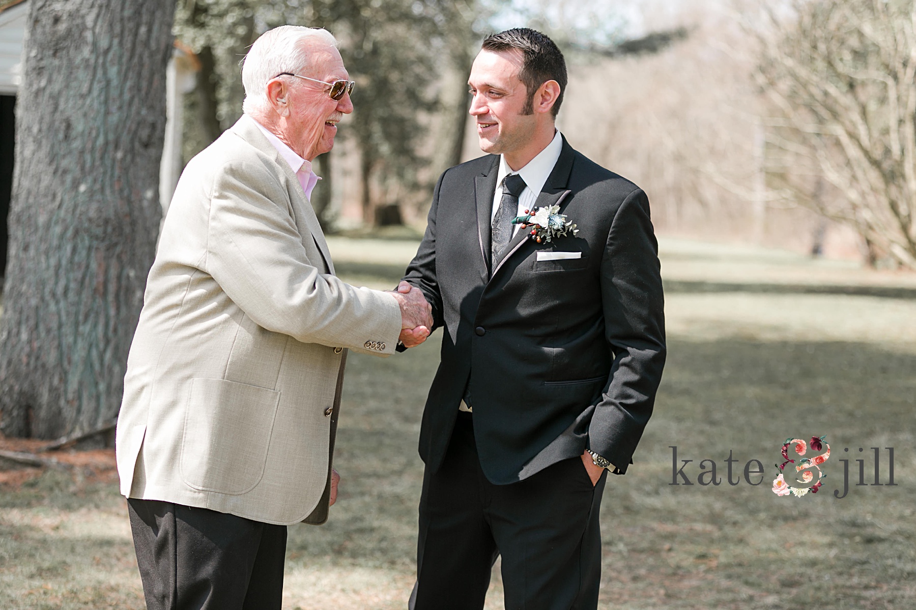 groom greeting guests before ceremony