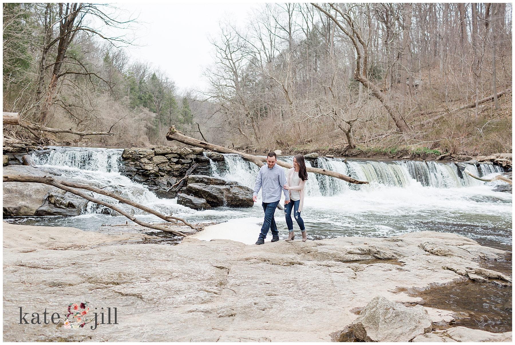 couple walking near waterfall philadelphia park