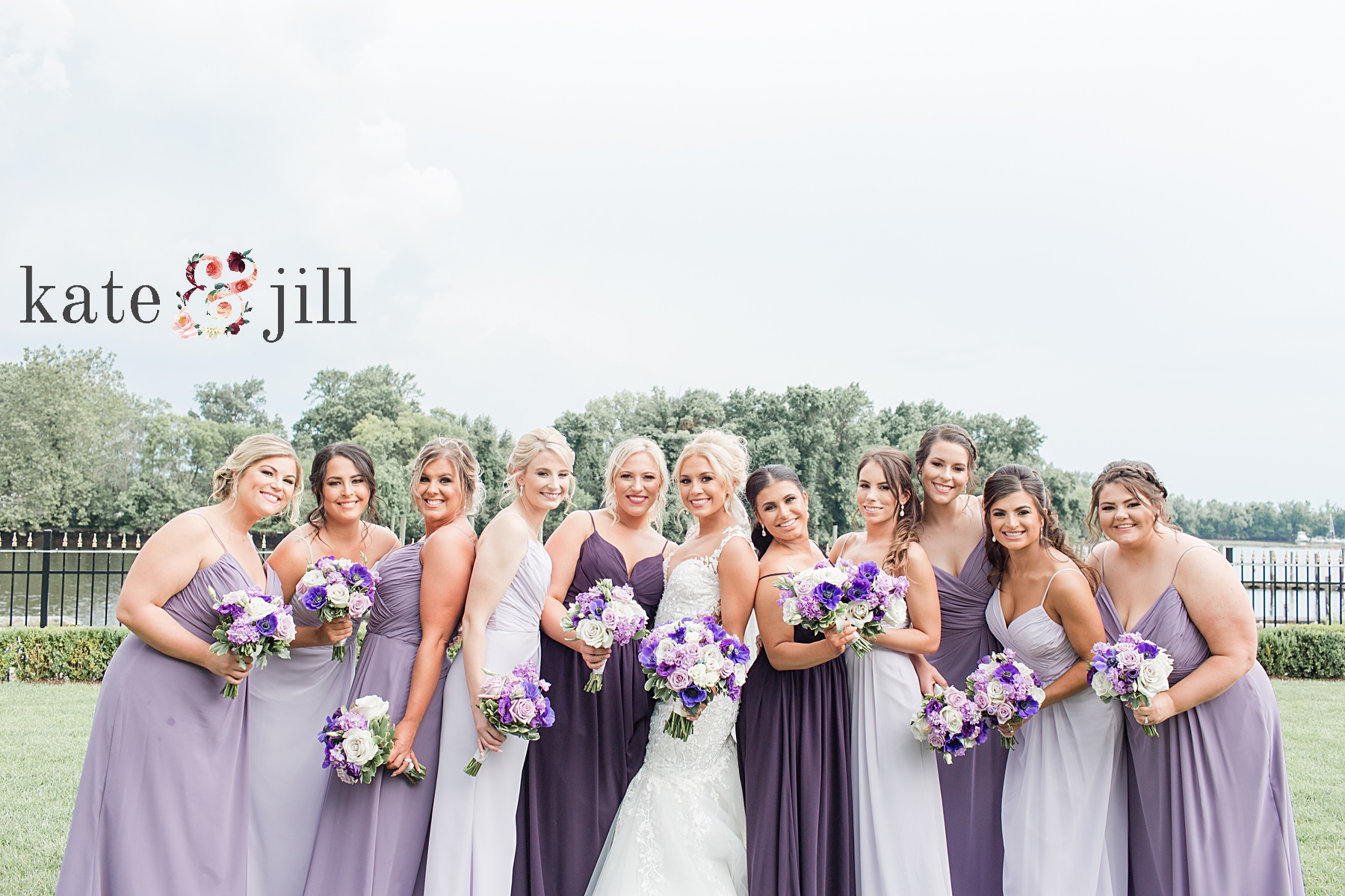 bridesmaids in purple dresses at clarks landing yacht club