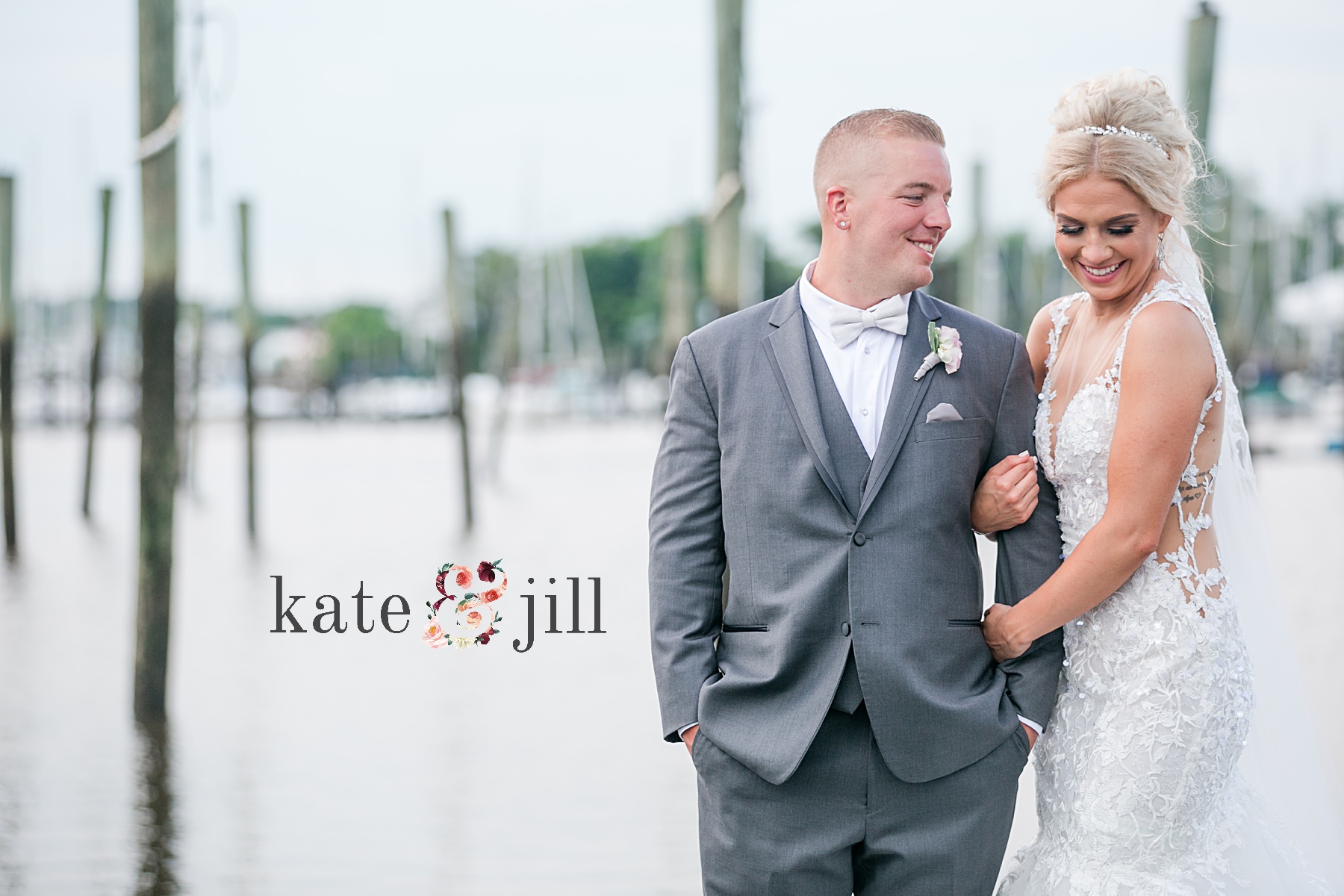 bride and groom on docks at clarks landing yacht club