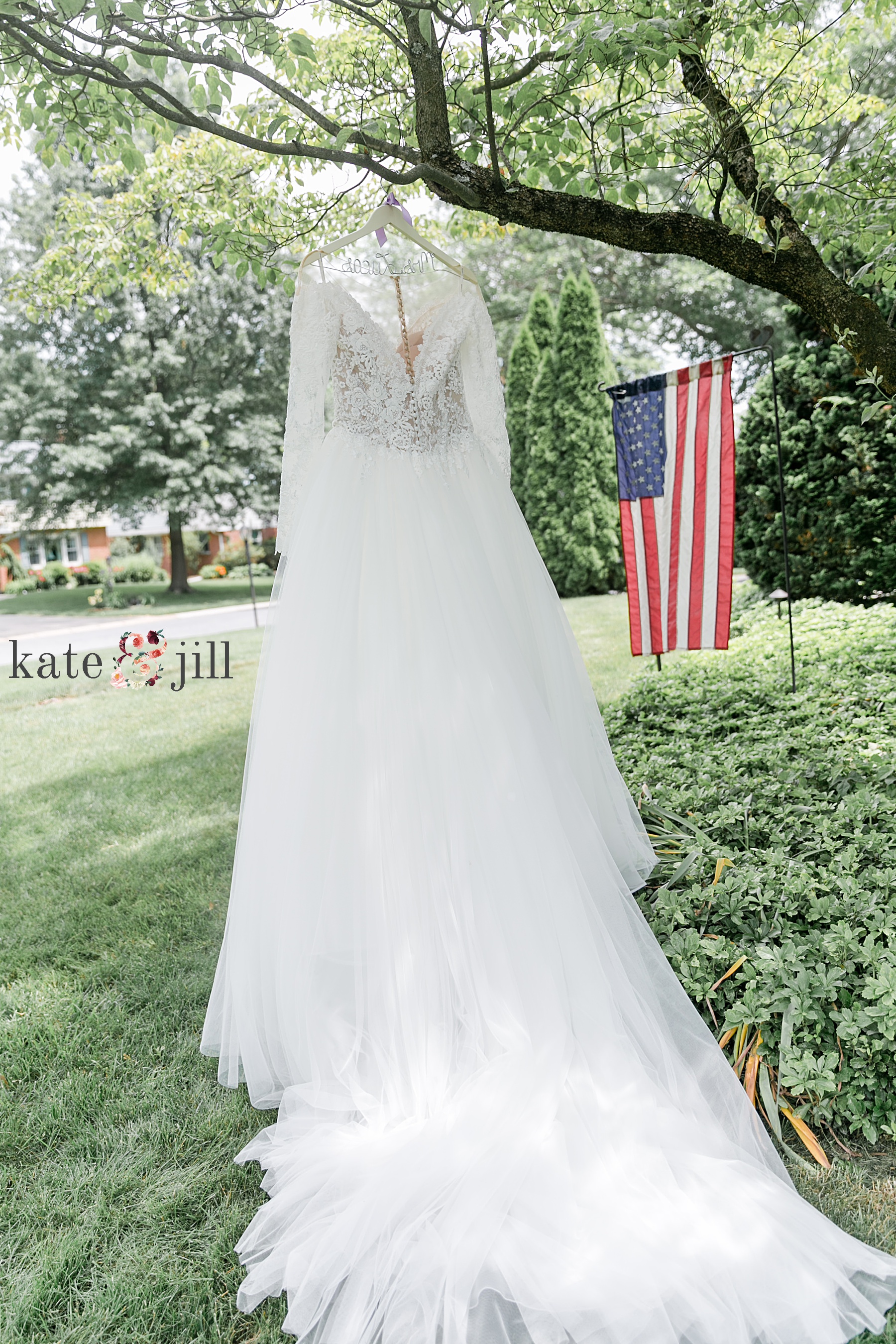 wedding gown hanging on tree