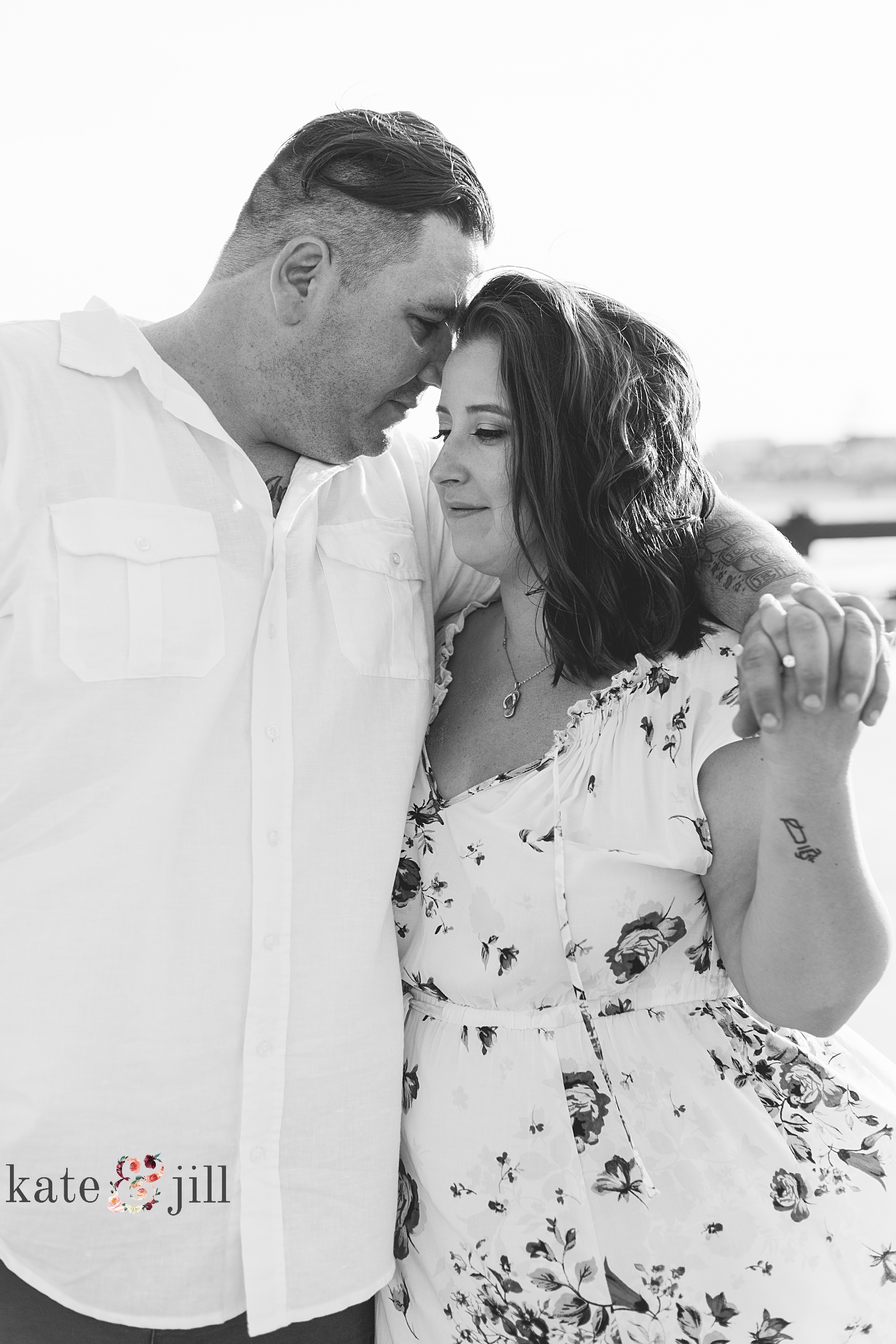 kissing forehead ocean city engagement session