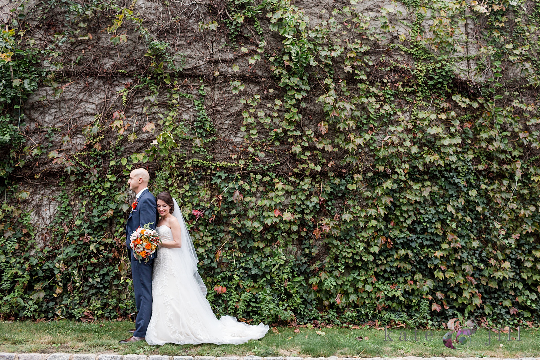 wedding first look in front of an ivy wall at Trump National golf course