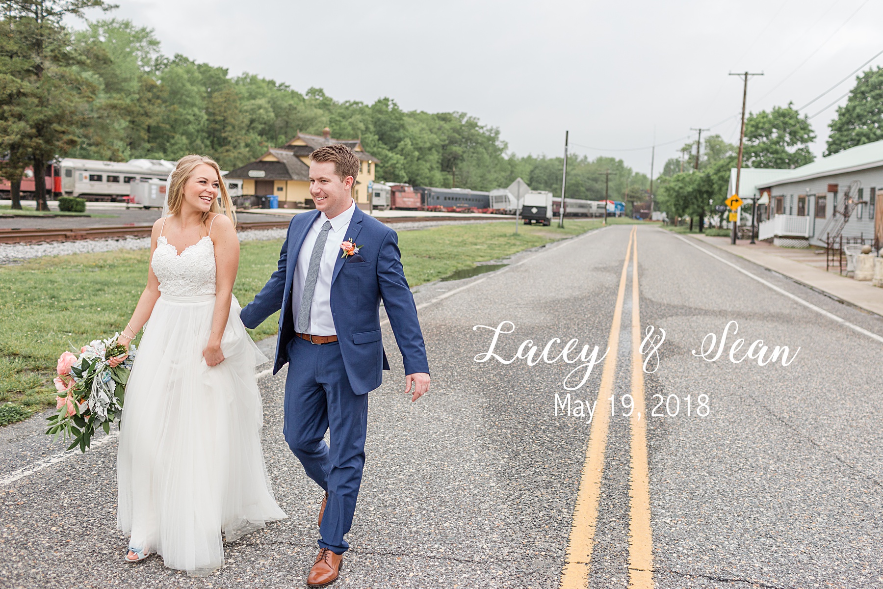 bride and groom walking in the street everly at railroad wedding
