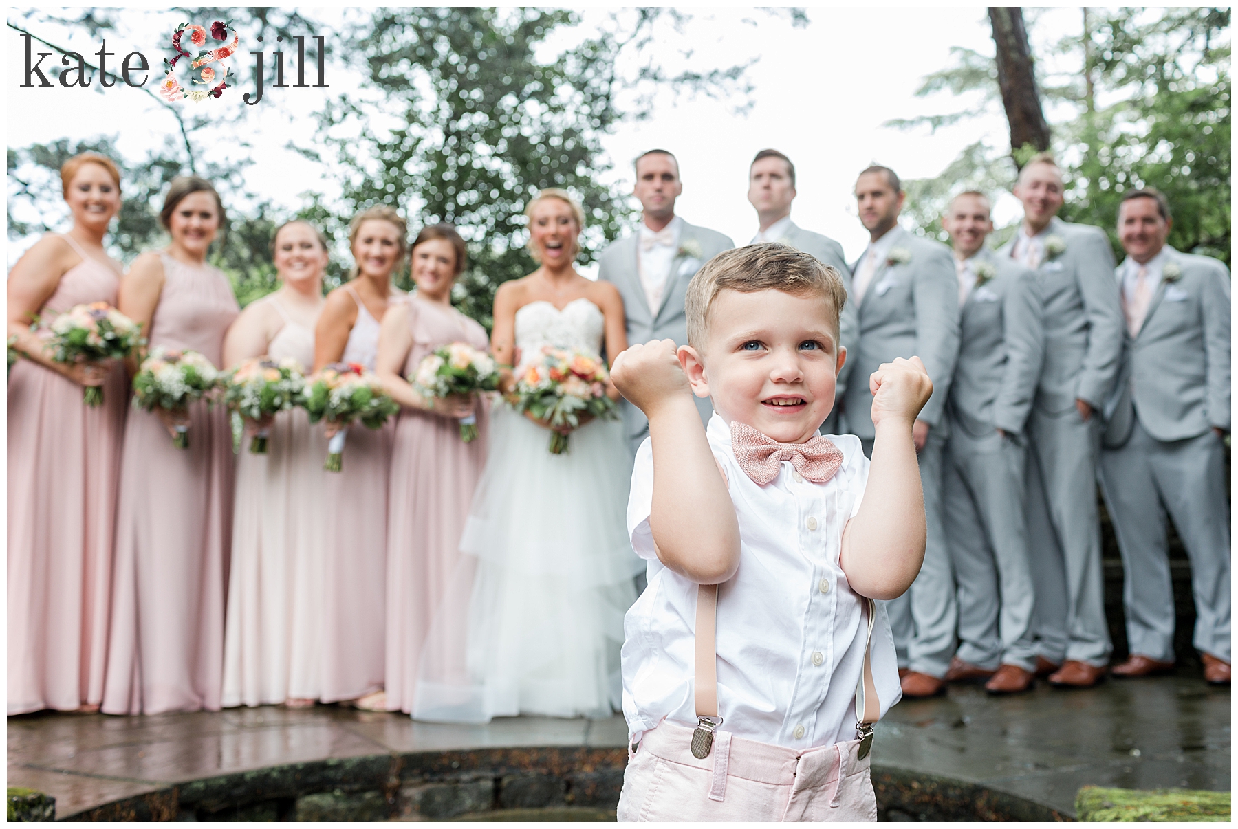 wedding party with ringbearer in front