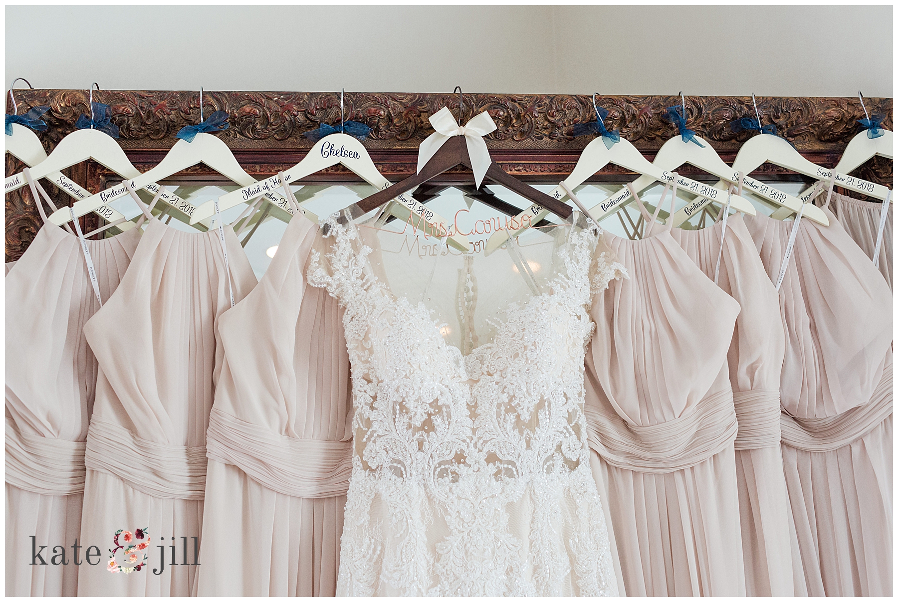 Wedding gown and bridesmaids dresses hanging