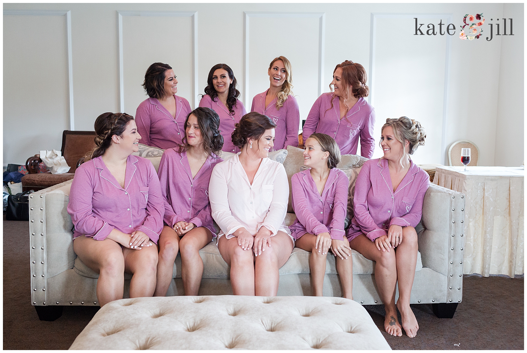 Bride with bridesmaids in robesat Carriage House