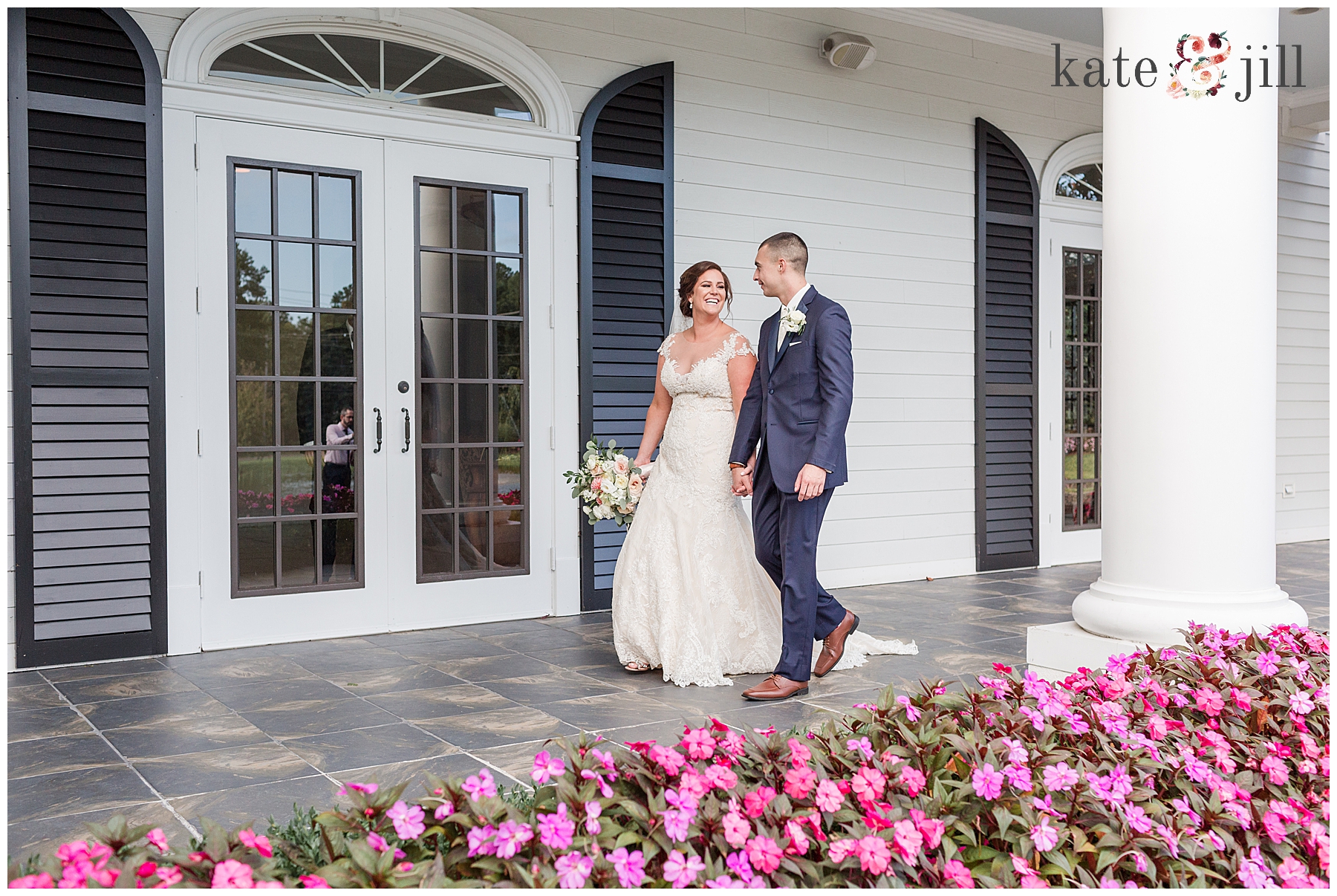 bride and groom walking at Carriage House