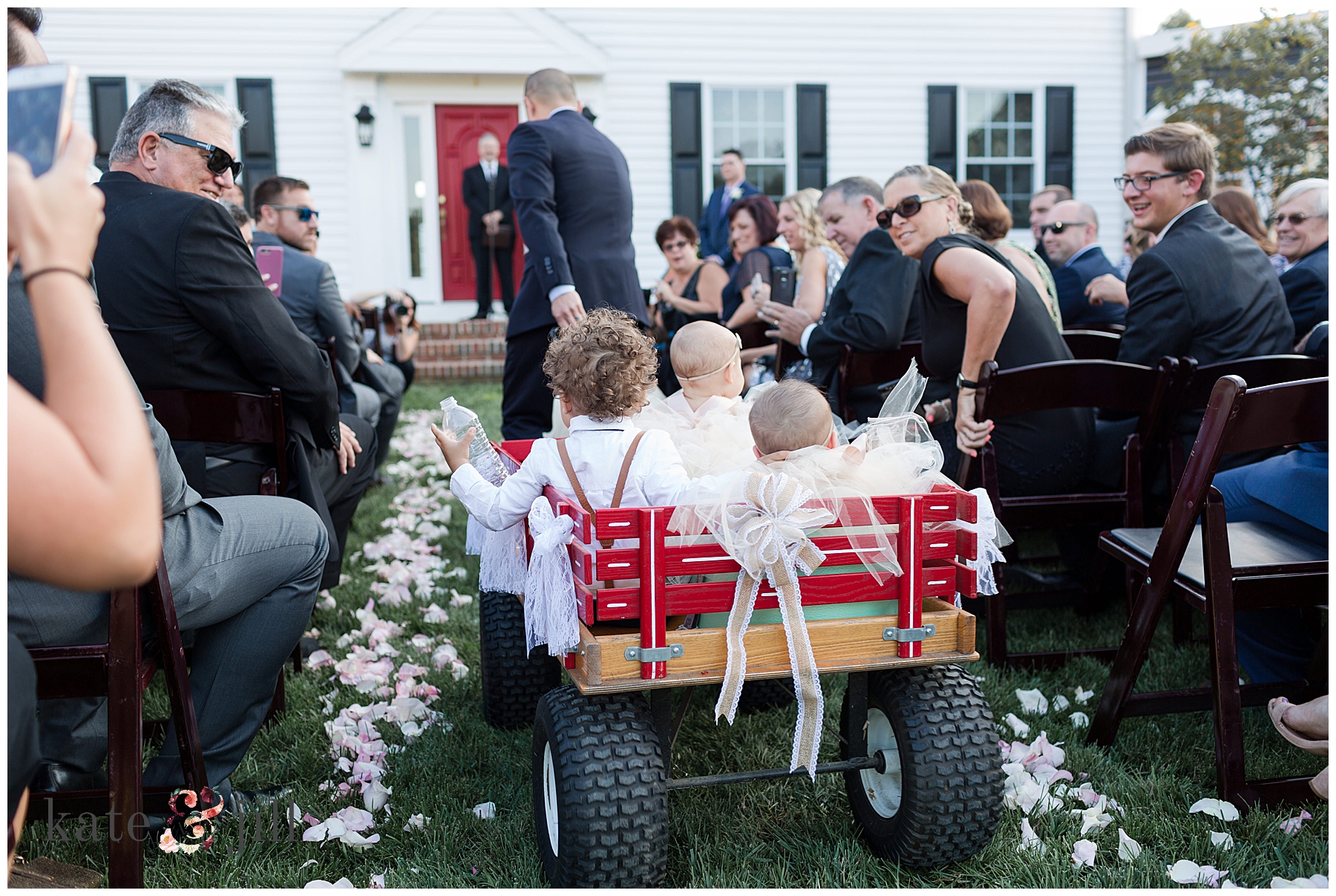 ring bearers and flower girls in wagon family home wedding